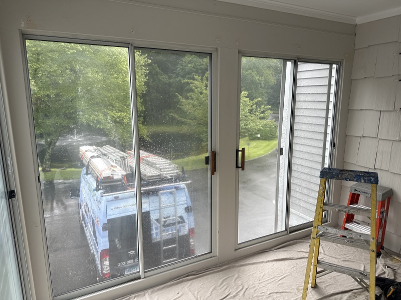 Outdated patio doors in this Brookfield porch
